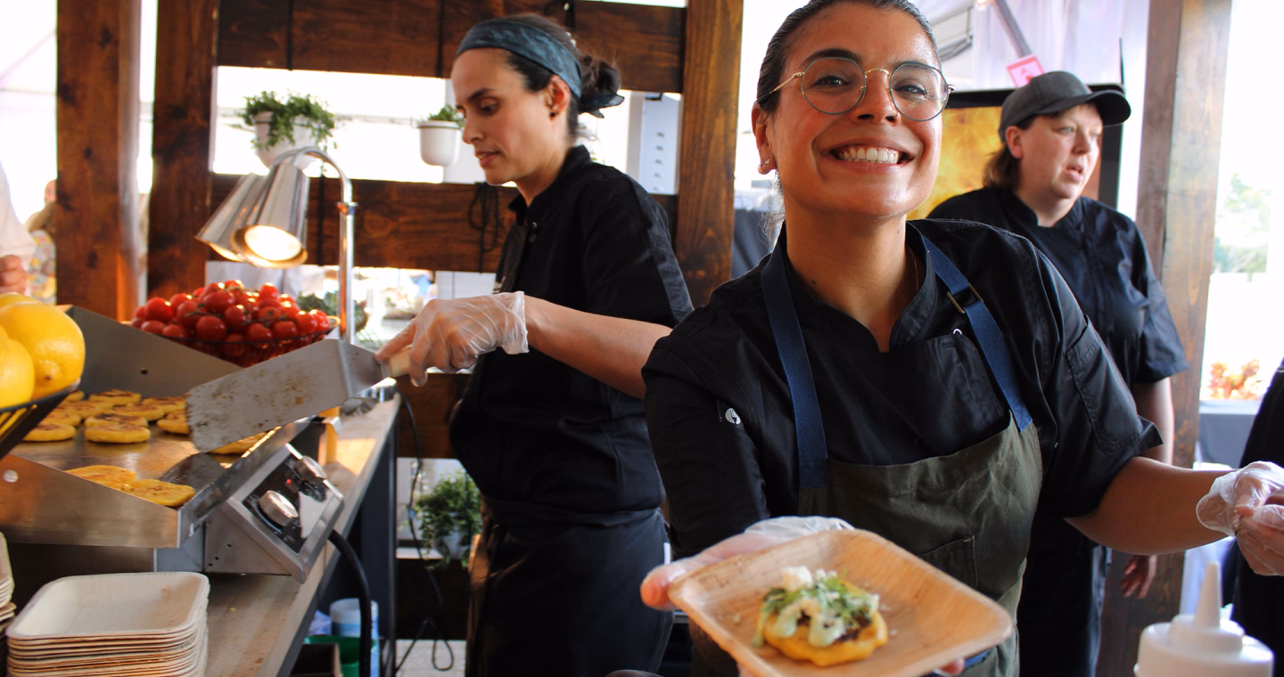 Smiling waitress serving food
