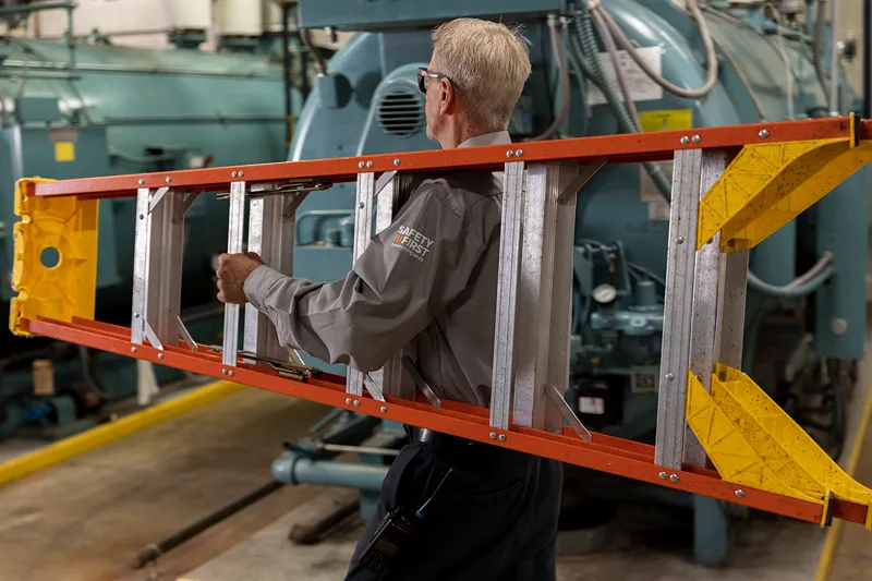 2 male employees are repairing machines