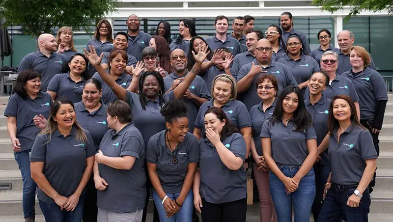A group of staff take a picture together