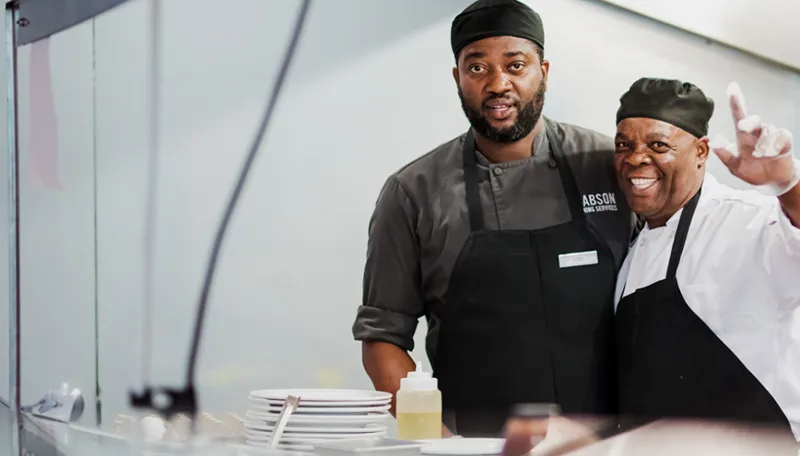 2 male chefs smiling