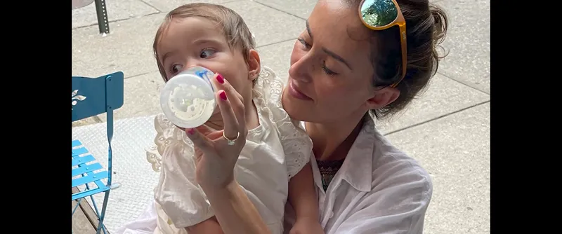 a woman holding a baby