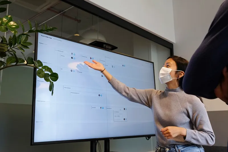 a woman giving a presentation