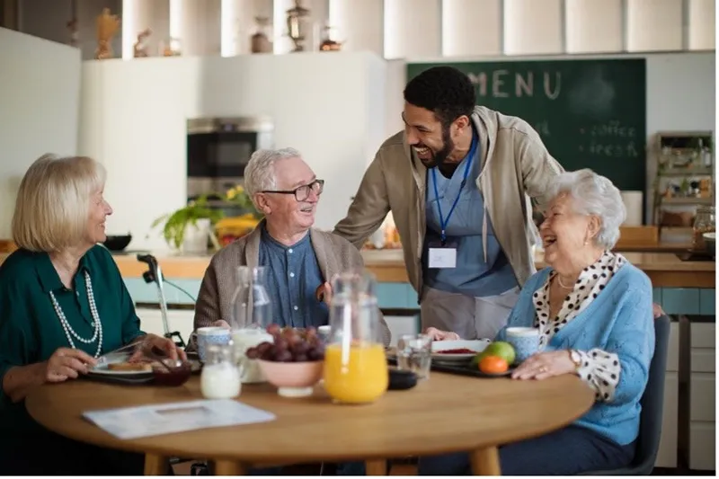 a male nurse taking care of old people